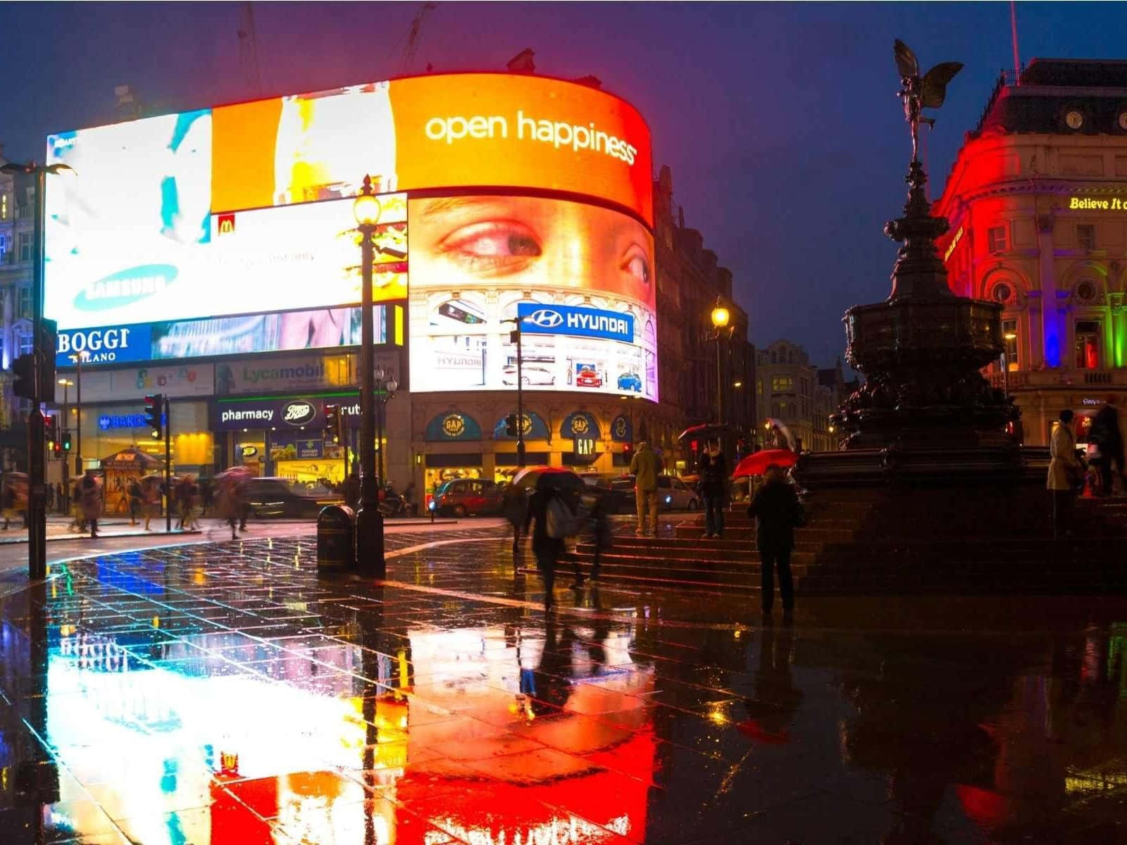 Vibrant Piccadilly Circus With Wet Floor Wallpaper