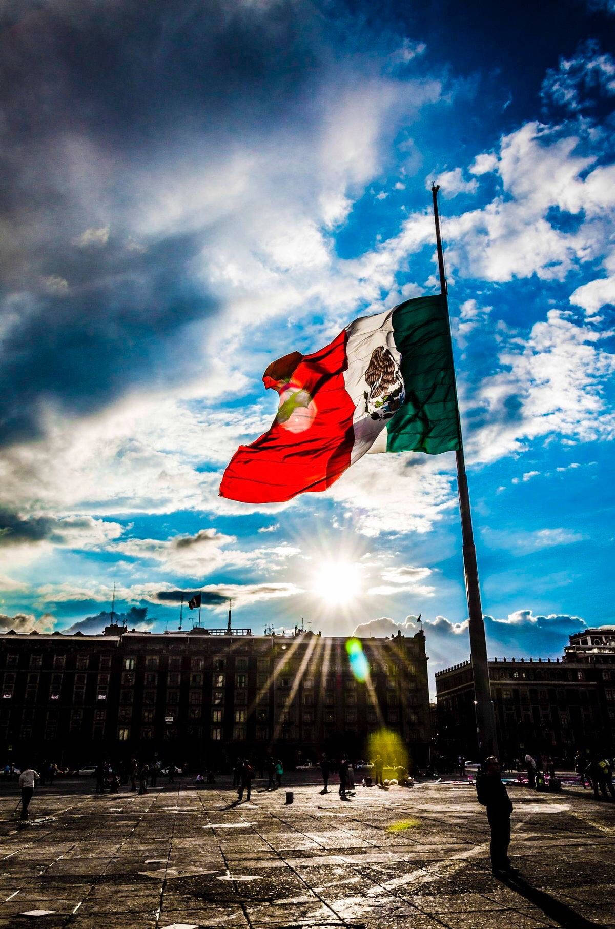 Vibrant Skies Above Mexico Flag Wallpaper