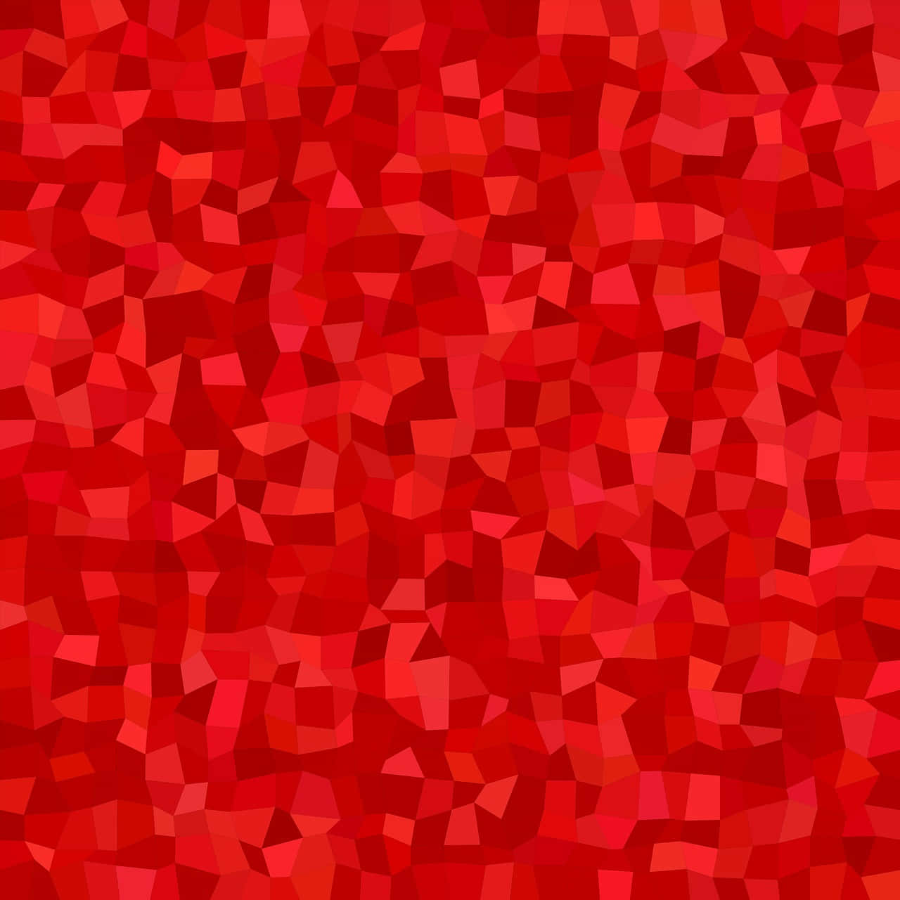 Vibrant Solid Red Background — A vibrant abstract pattern of irregular red polygonal shapes creating a dynamic textured mosaic.