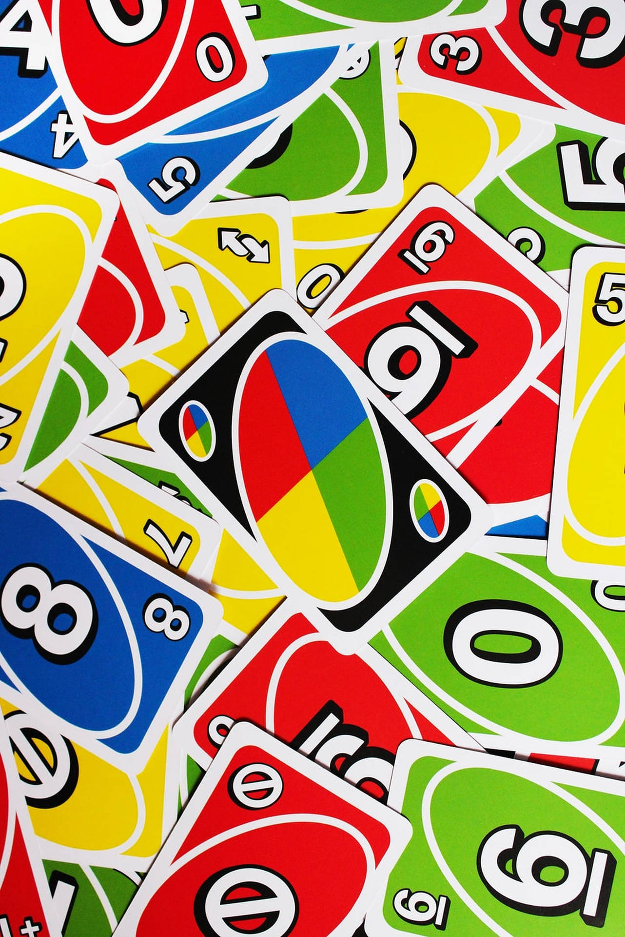 Vibrantly Colored Uno Cards Spread Out Wallpaper