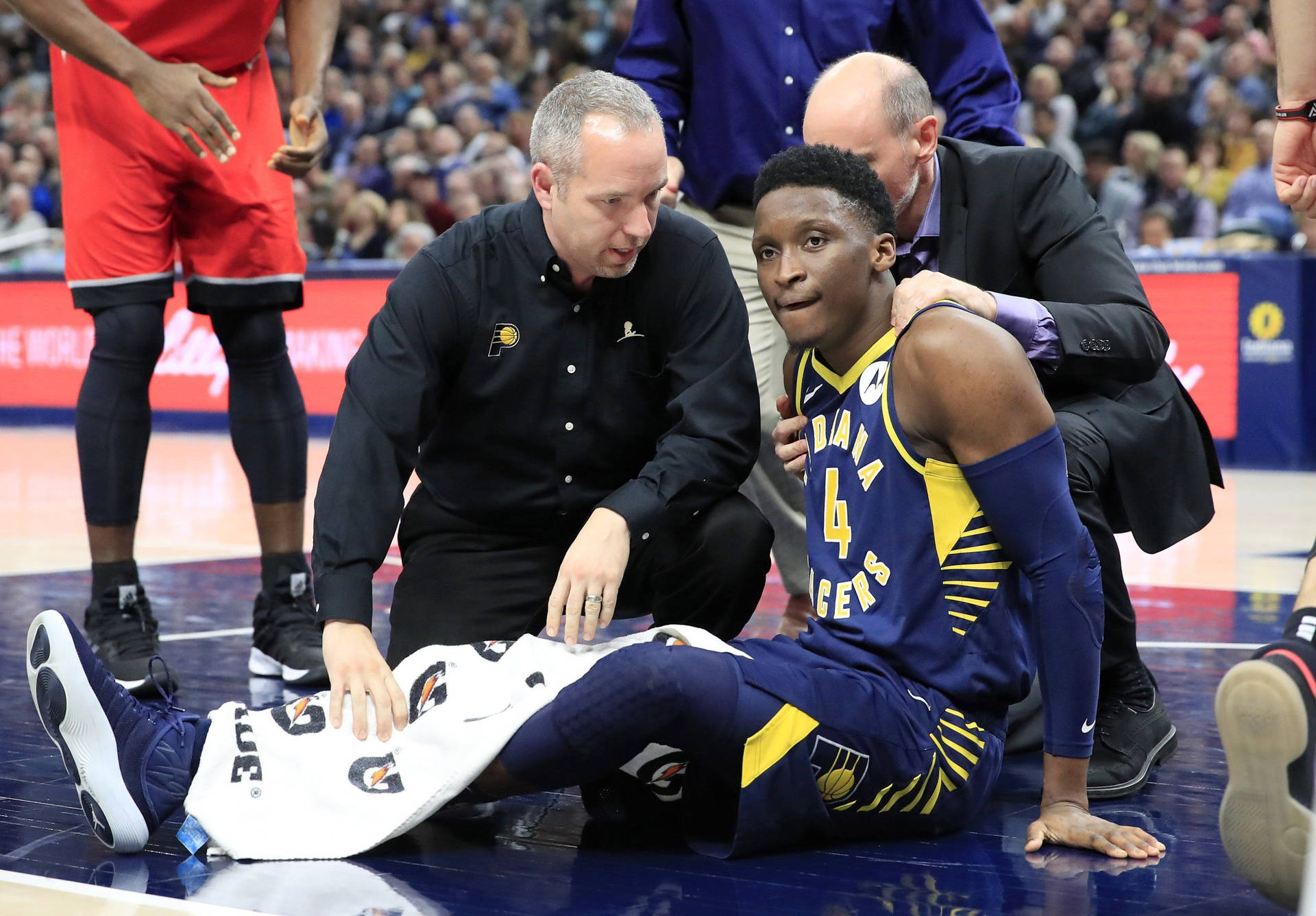Victor Oladipo With Coach And Referee Wallpaper
