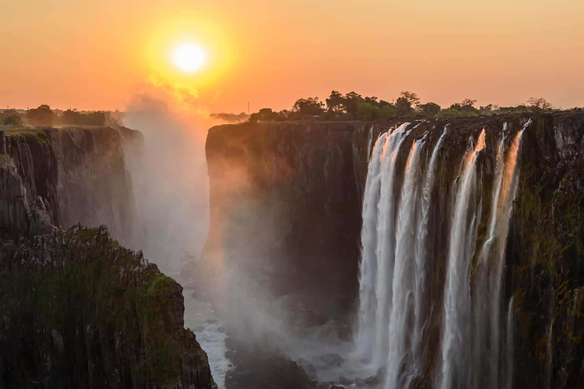 Majestic Sunset Over Victoria Falls Wallpaper