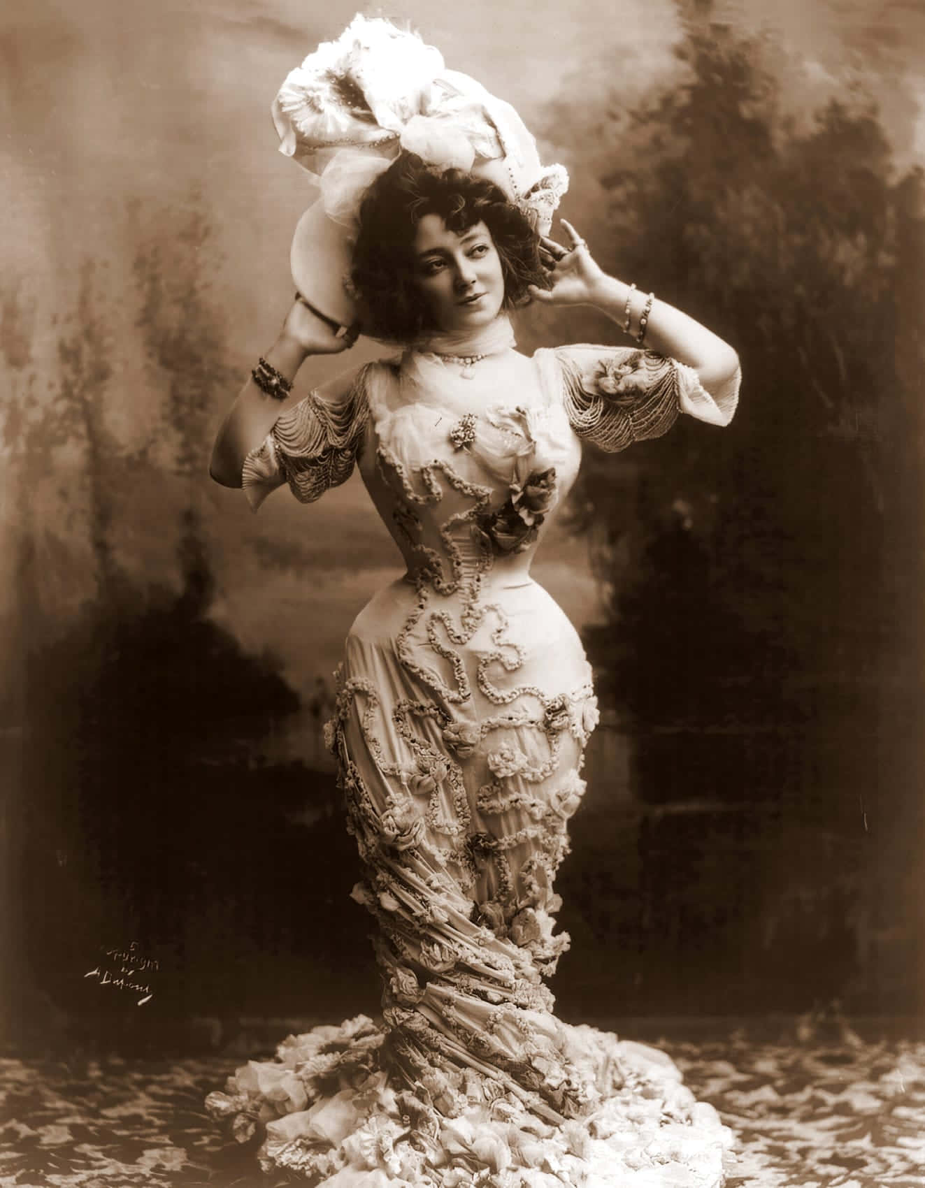 A Woman In A Dress With A Hat On Her Head
