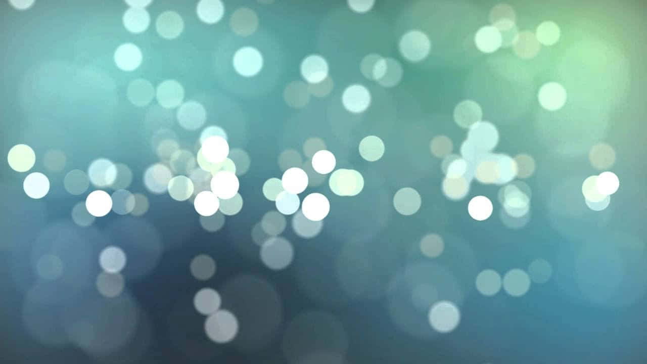A Blue And Green Background With Bokeh Lights Wallpaper