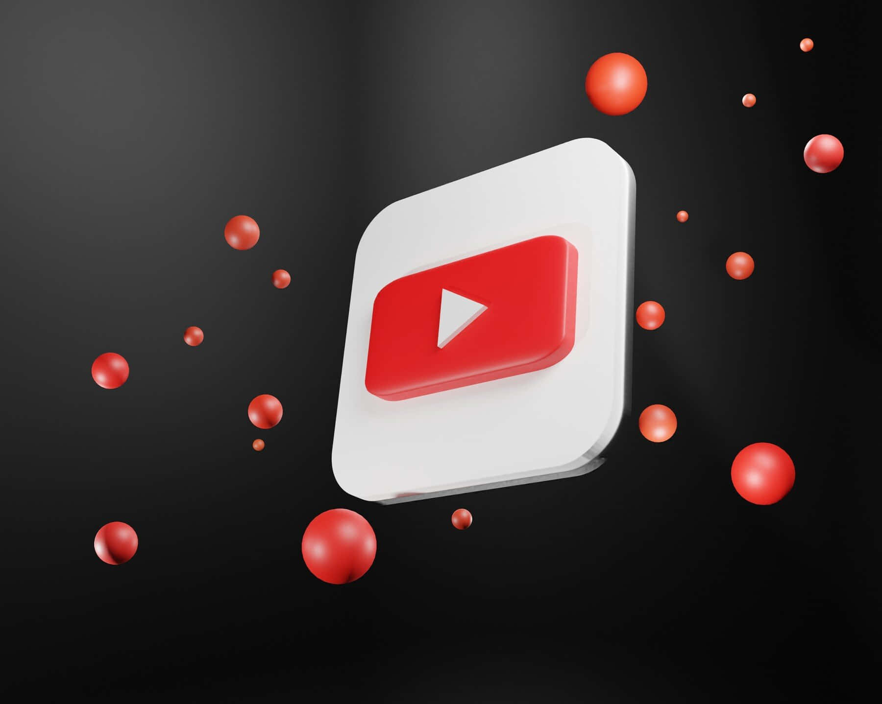 Youtube Logo With Red Balls Flying Around Wallpaper