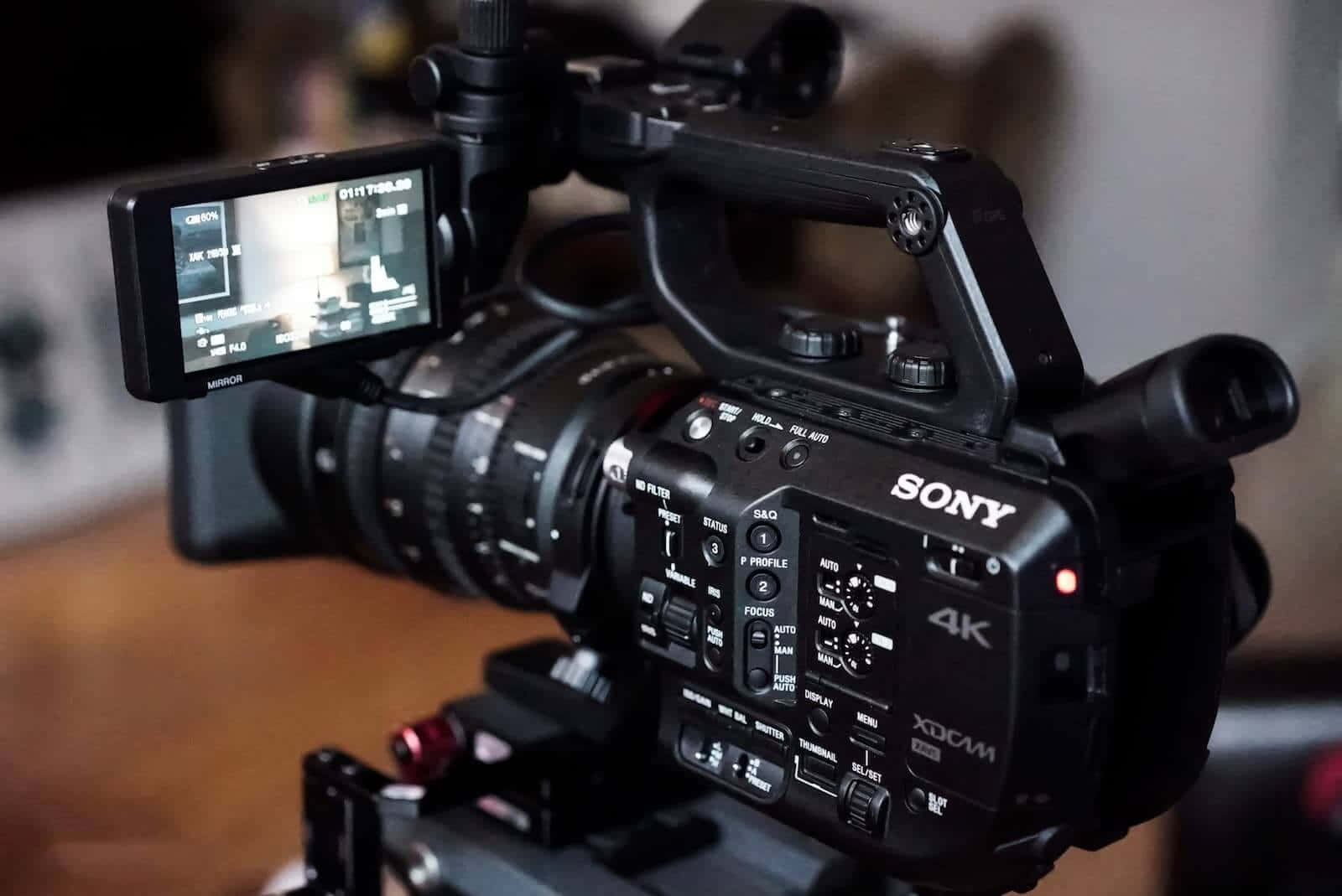 A Sony C300 Ccd Camera With A Lens Attached Wallpaper