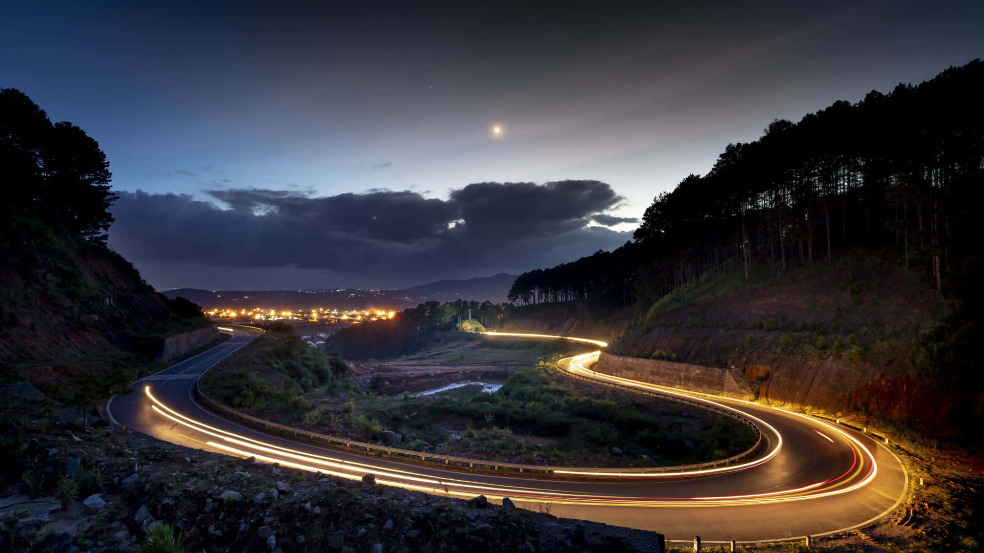 A Road With Light Trails At Night