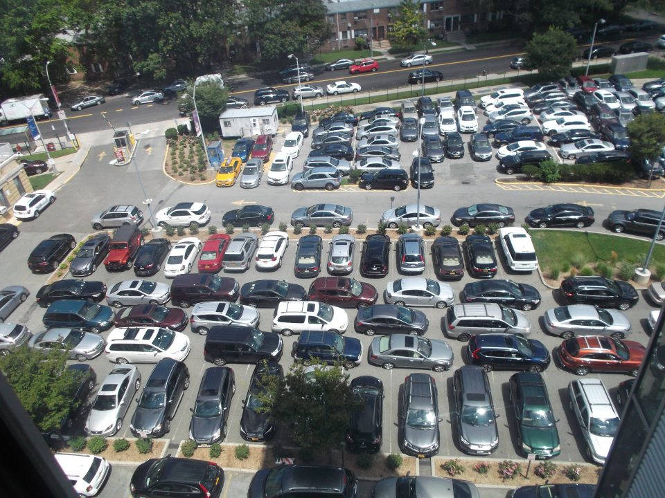 "Aerial View of an Occupied Parking Lot" Wallpaper