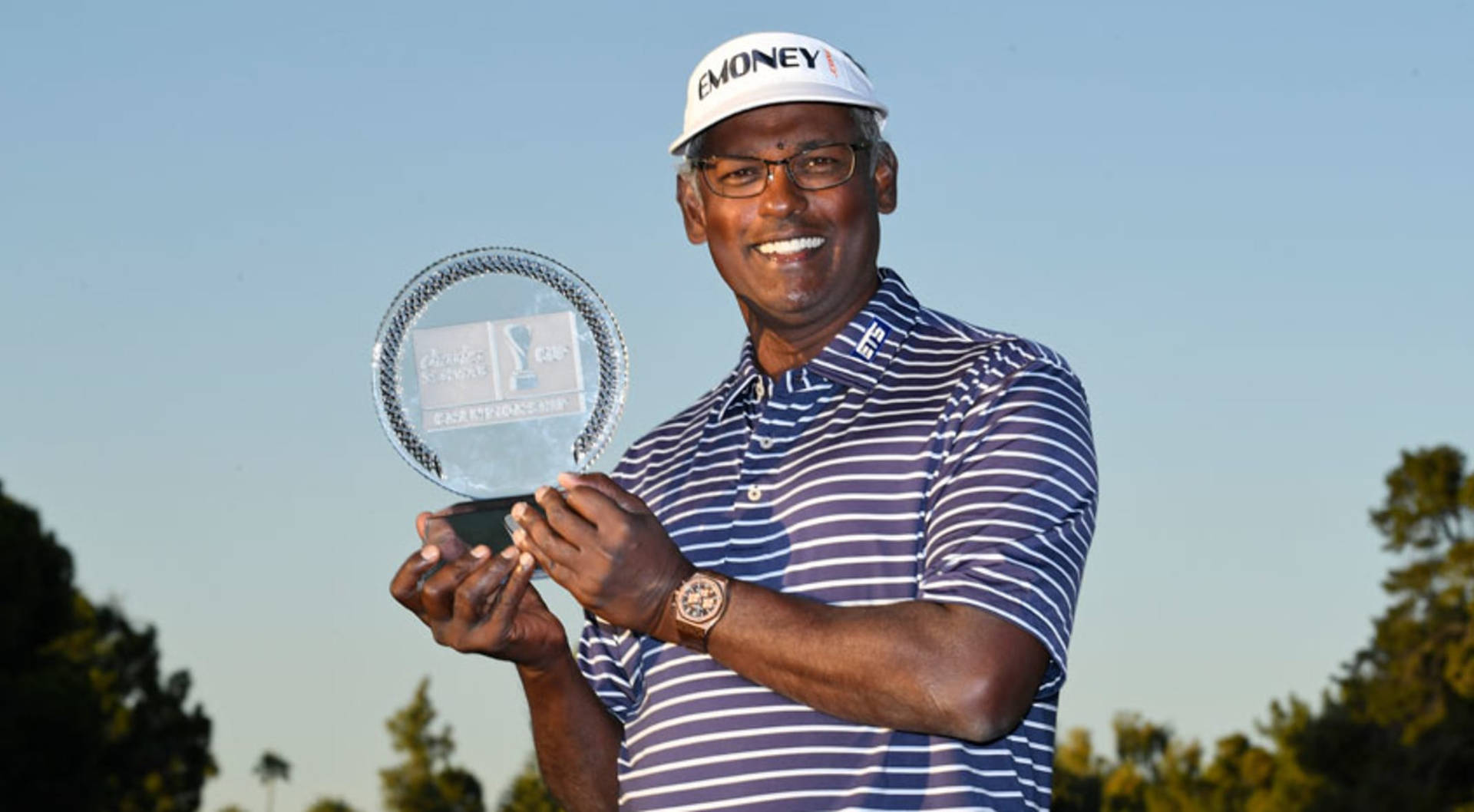 Vijay Singh Smiling And Holding Trophy Wallpaper