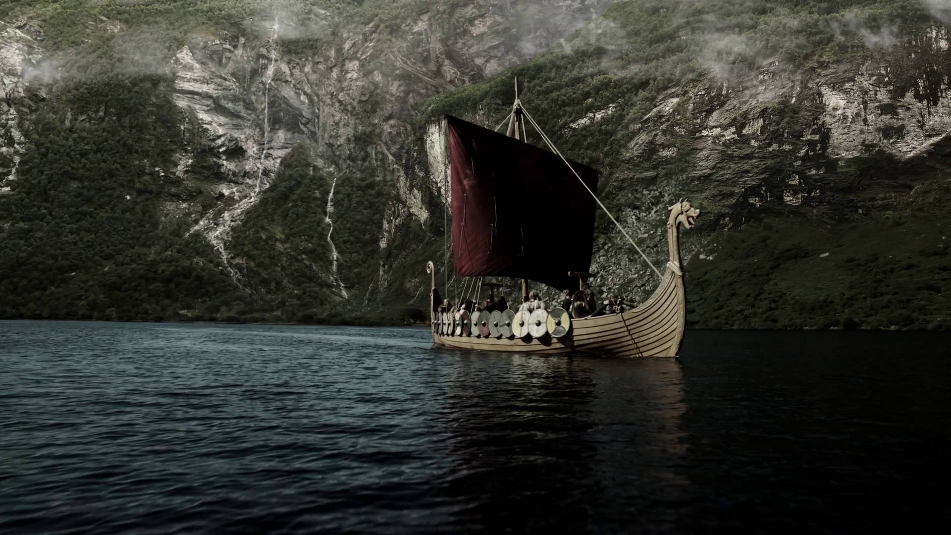 A Maroon-Sailed Viking Longship on the Open Seas Wallpaper