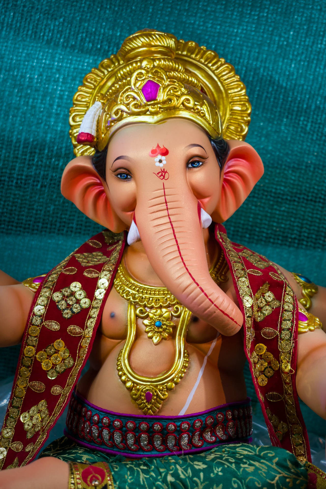 Vinayaka In Red And Blue Clothes Wallpaper