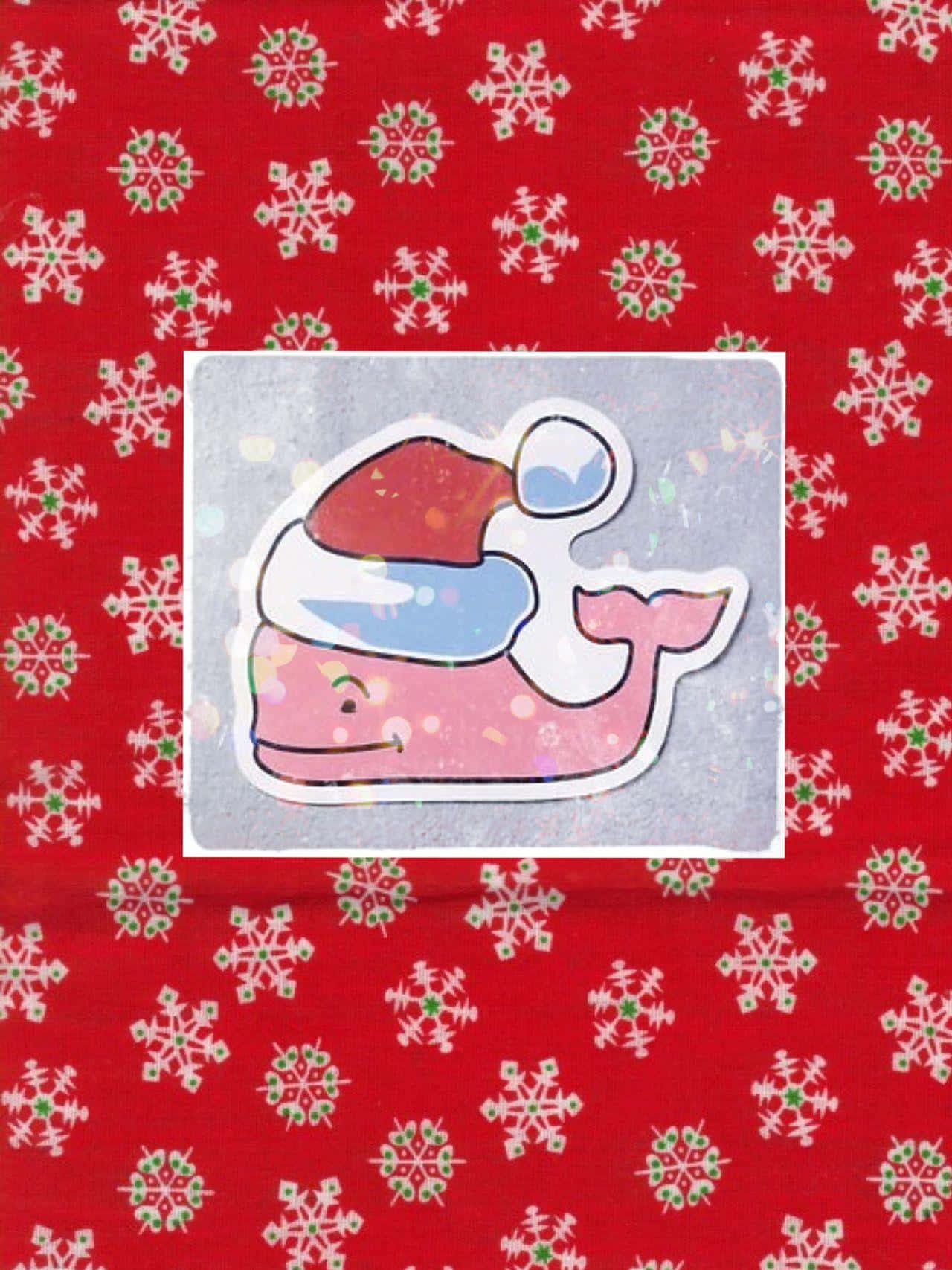 En pink hval med en juleskovl på en rød baggrund Wallpaper