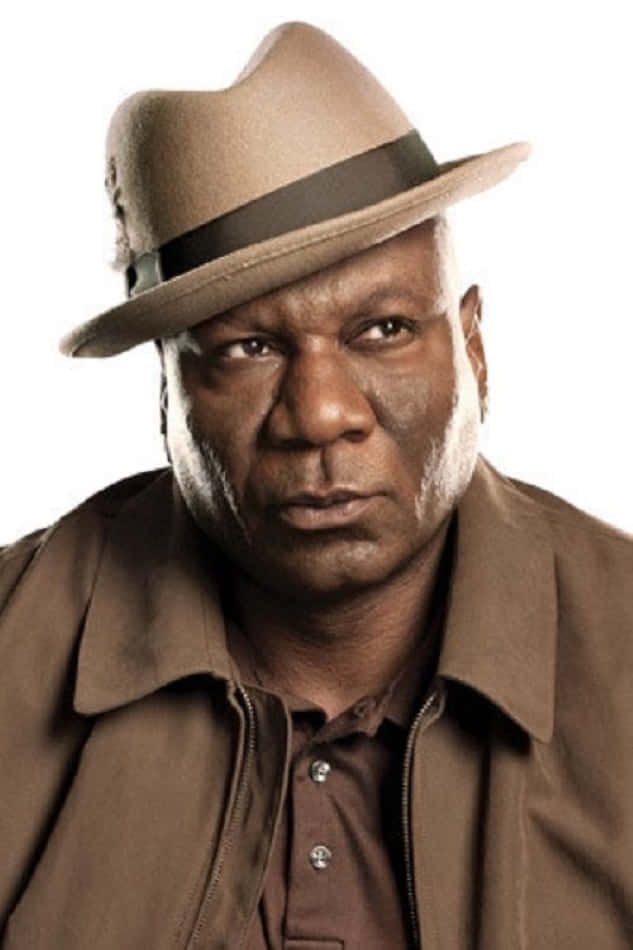Ving Rhames confidently posing for a photo shoot Wallpaper