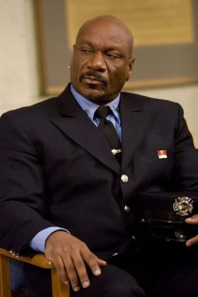 Ving Rhames striking a pose in a stylish suit Wallpaper