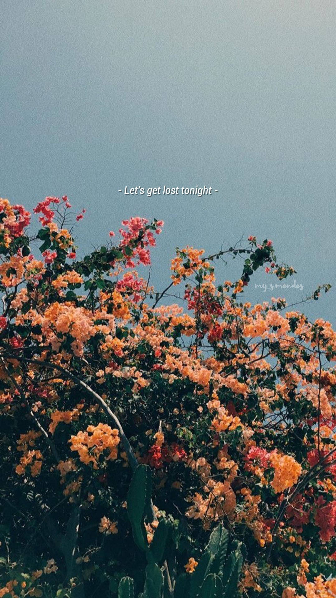 A Photo Of Flowers With The Words'you Get What You Think' Wallpaper