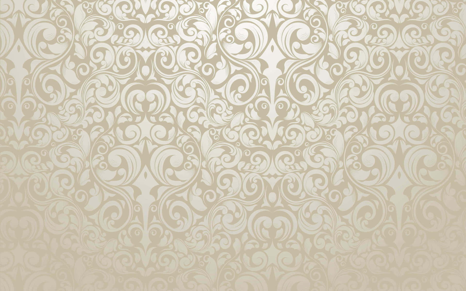 a beige and gold wallpaper with swirls