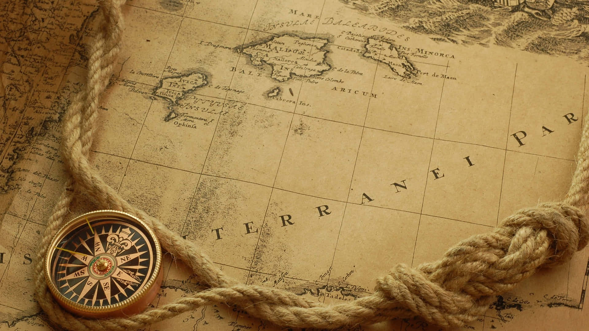 a compass and rope on an old map