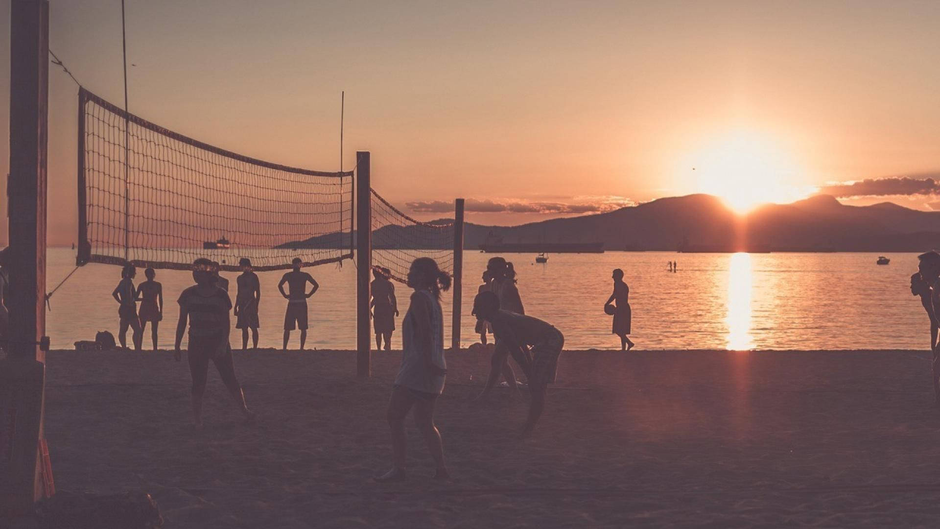 Vintage Beach Volleyball At Sunset Shot Wallpaper