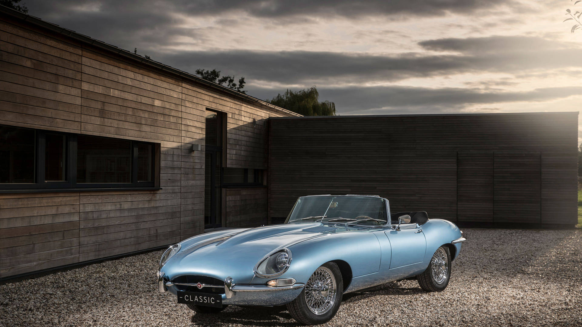Head-turning classic: vintage blue Jaguar Convertible Wallpaper