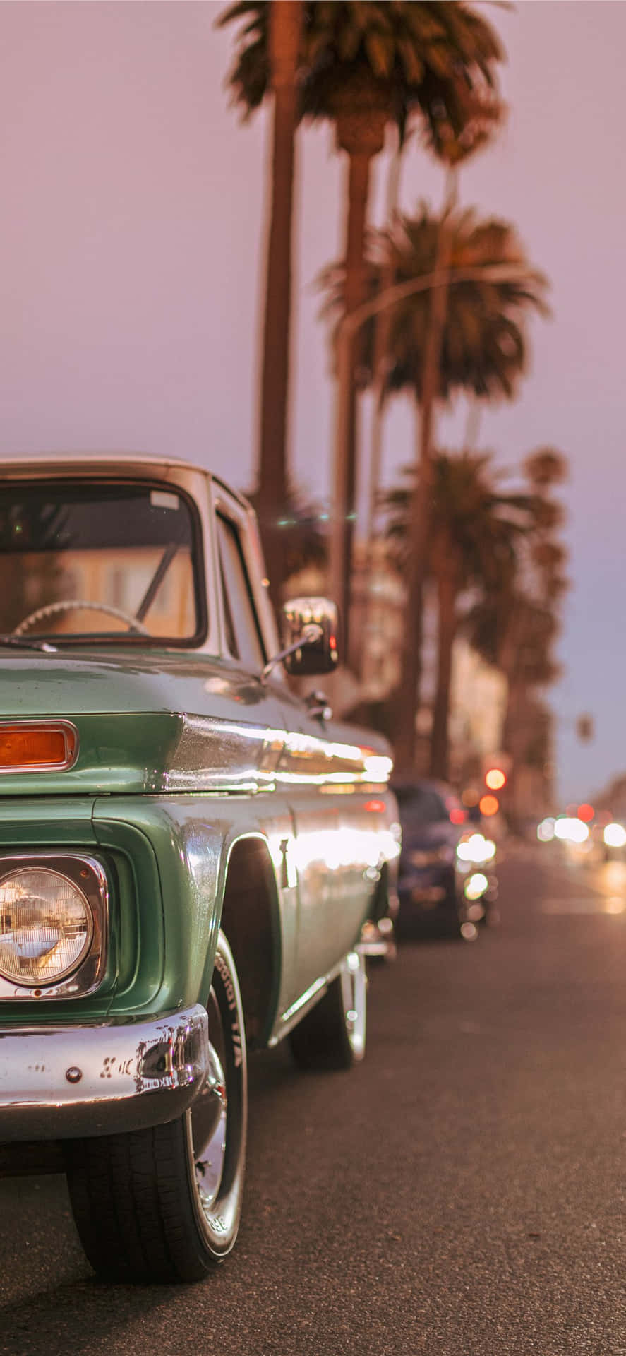 The Open Road to Exploration in a Vintage Car Wallpaper