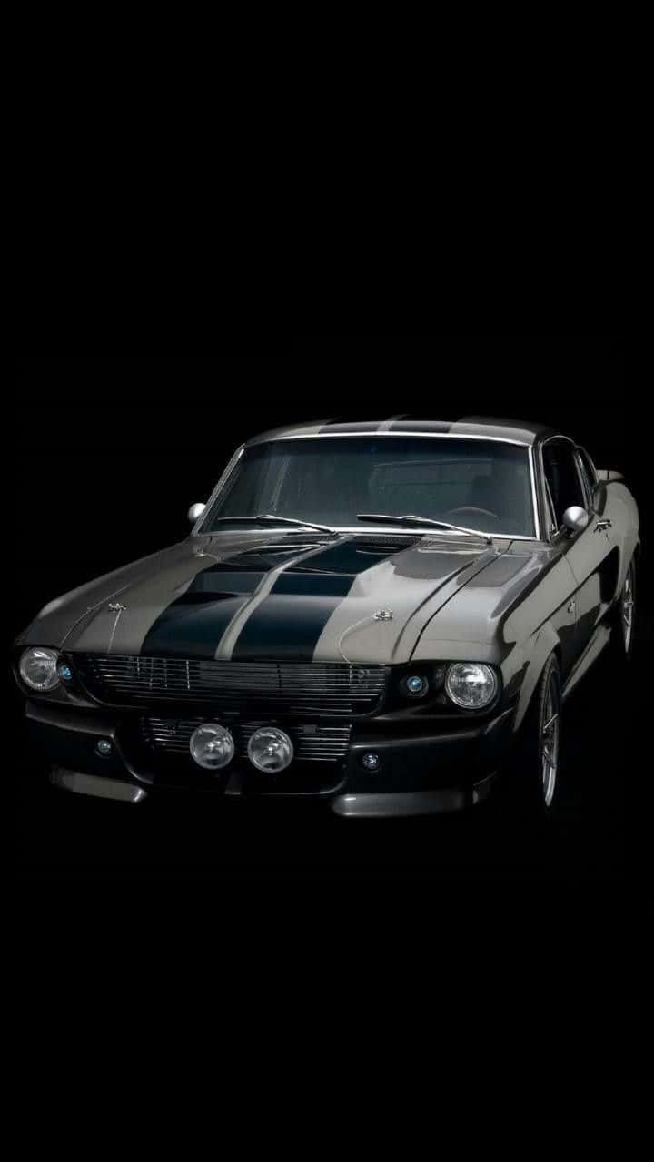 A Black And Silver Mustang Is Shown In The Background Wallpaper