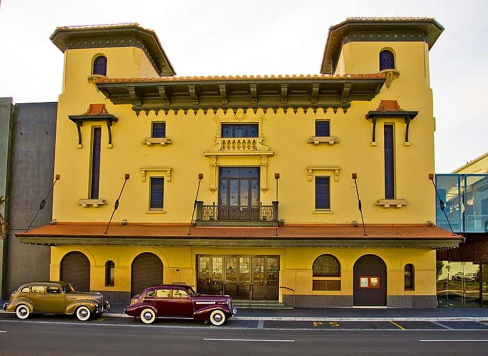 Vintage Cars Outside Historic Building Hastings N Z Wallpaper