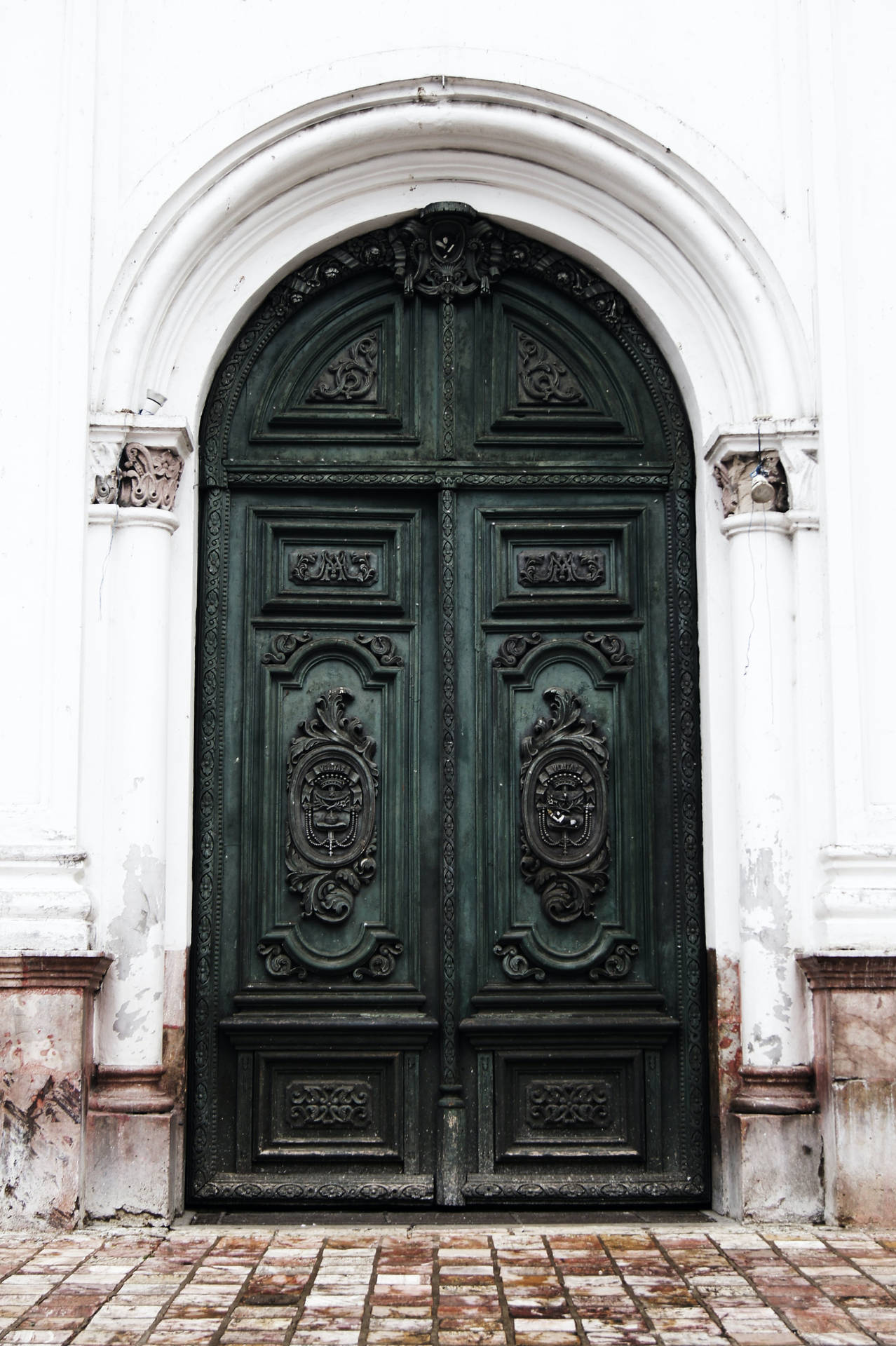 Caption: Vintage Carved Green Double Doors Wallpaper
