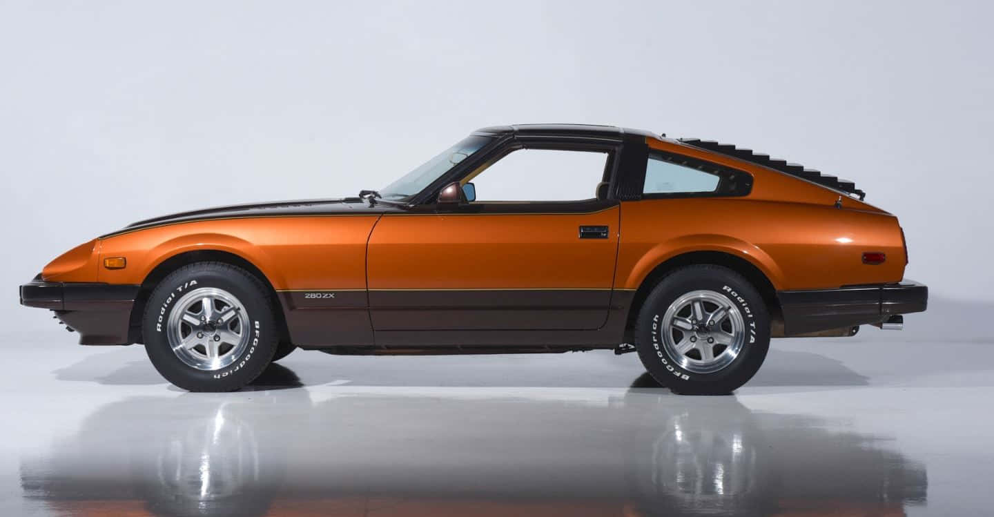 Vintage Datsun 280zx Parked Admid The Fascinating Nature View. Wallpaper