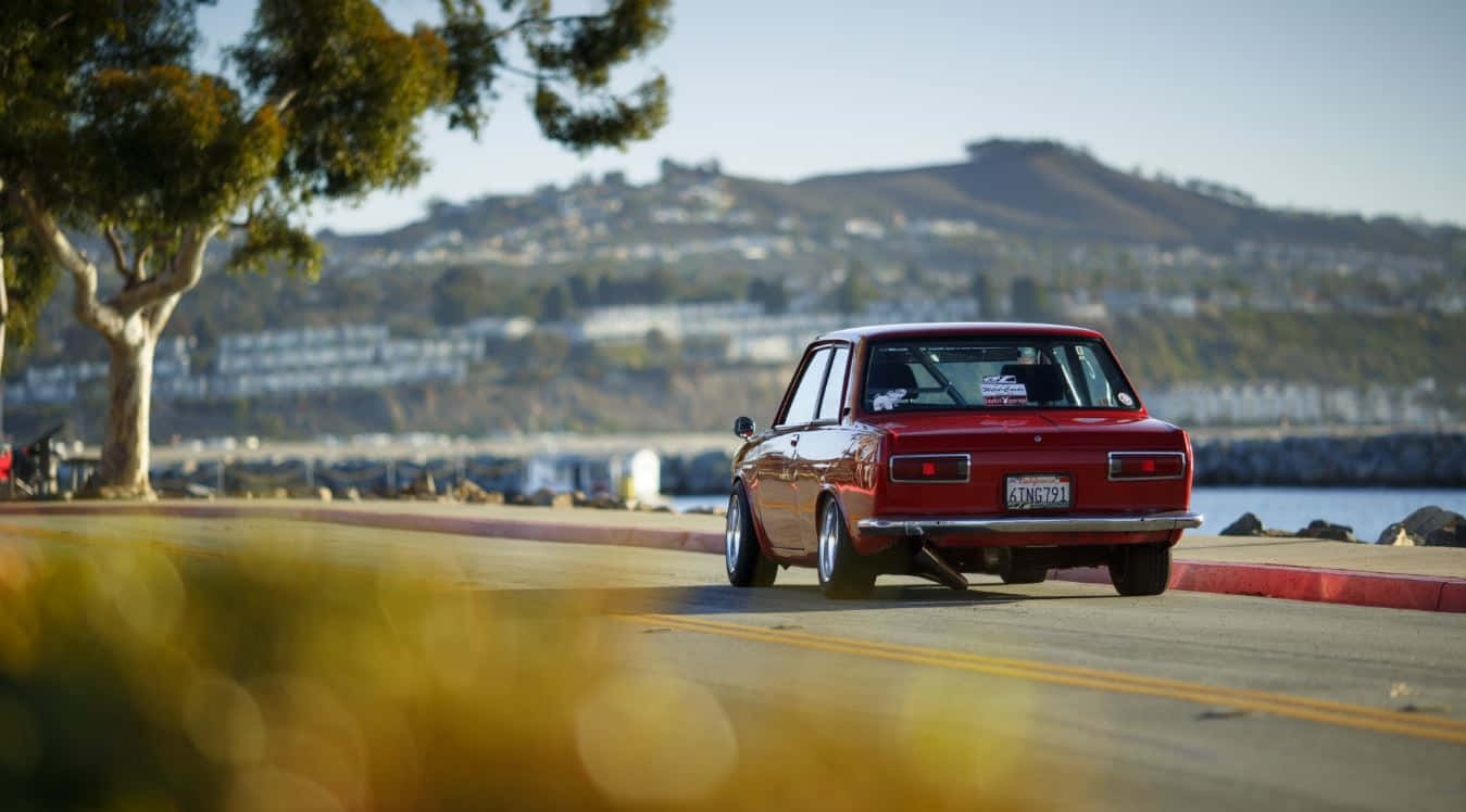 Vintage Datsun 510 - A Memory Of Speed And Style Wallpaper