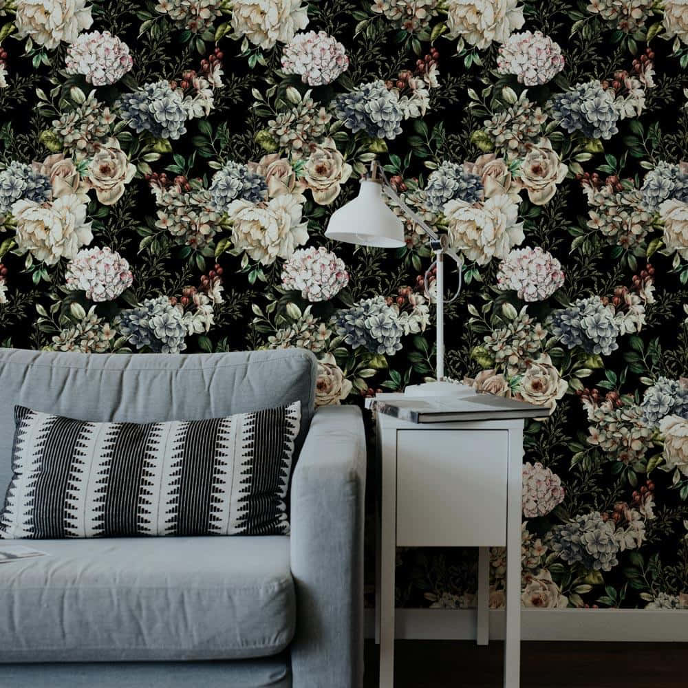A Living Room With A Black Floral Wallpaper