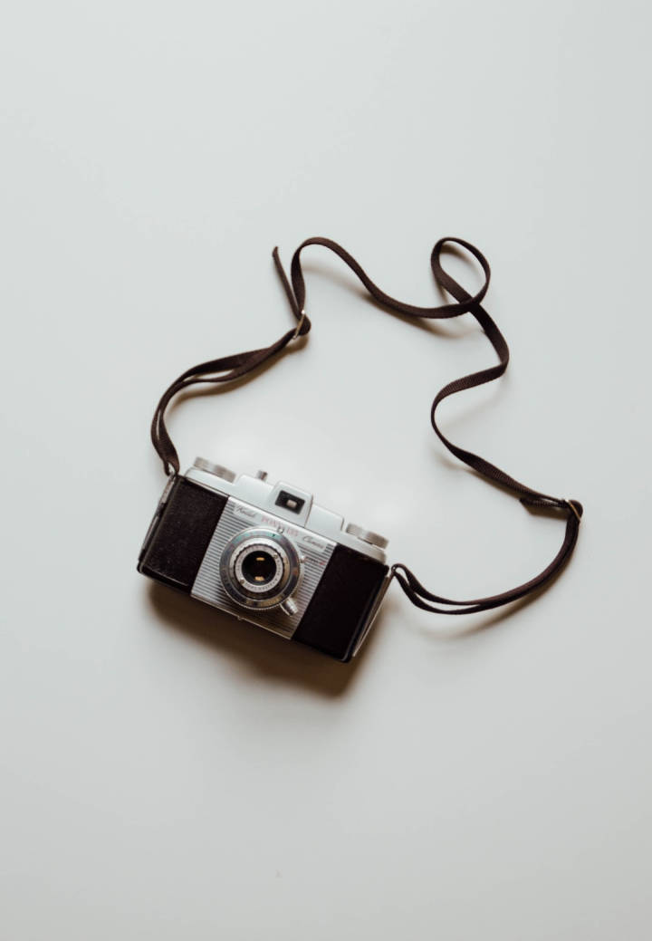 Vintage Minimalist Camera With Strap Wallpaper