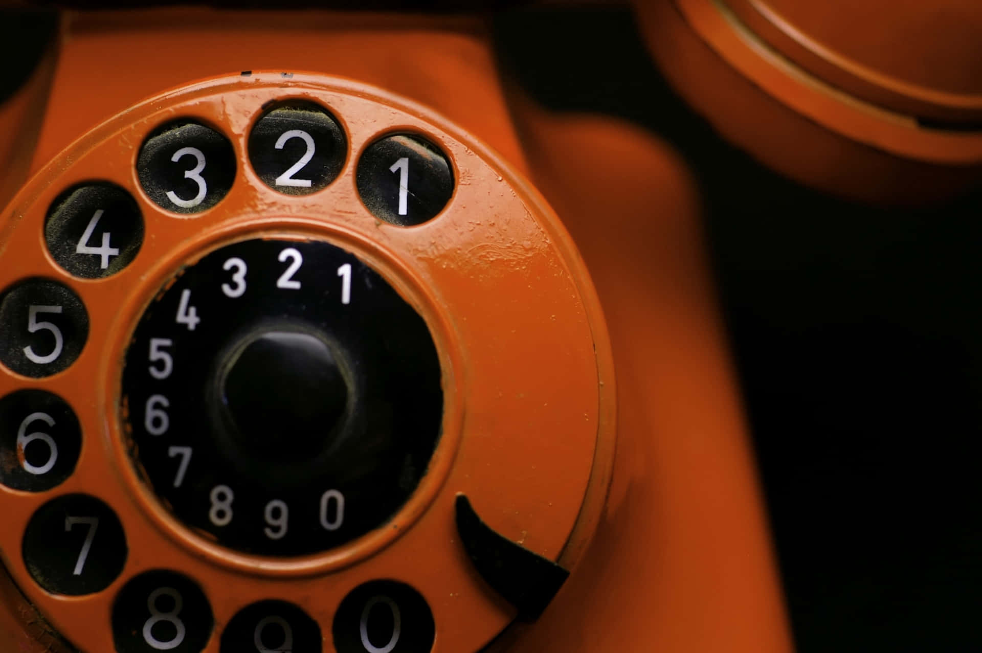 Vintage Orange Rotary Phone Dial Wallpaper