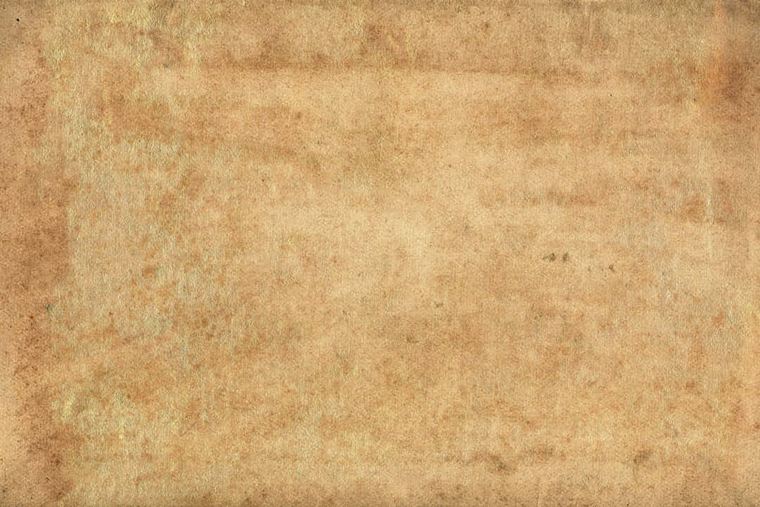 An Old Paper Background With A Brown Color