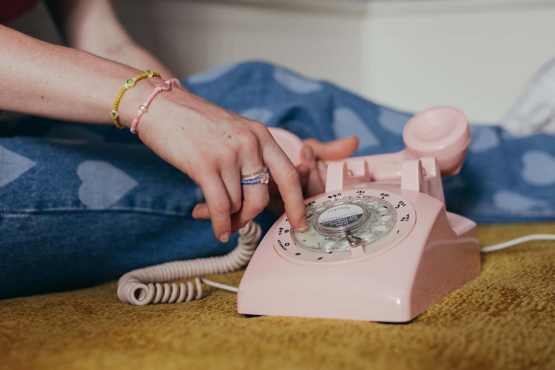 Vintage Pink Rotary Phone Dialing Wallpaper