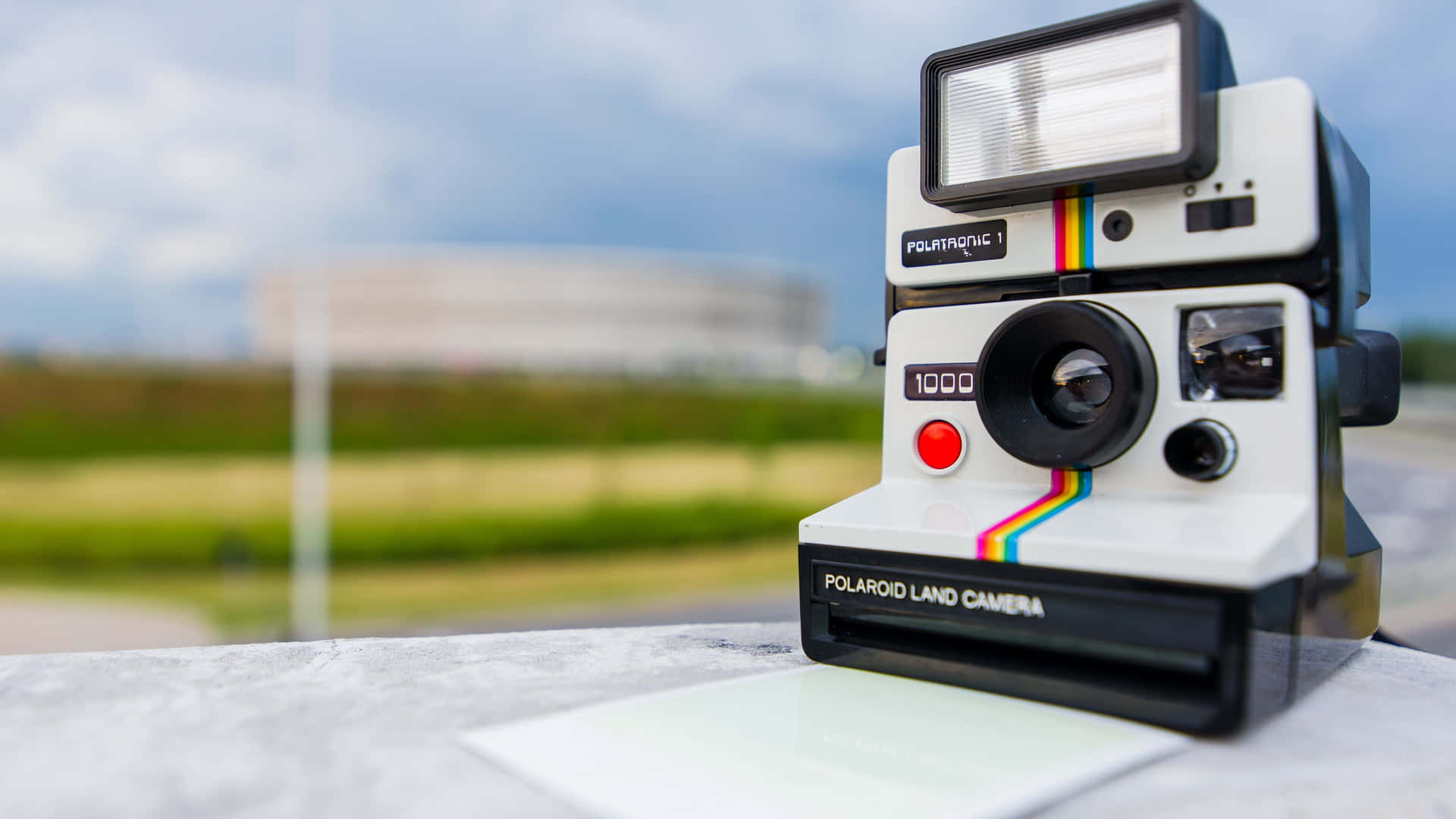 Vintage Polaroid Camera With A Nostalgic Charm Wallpaper