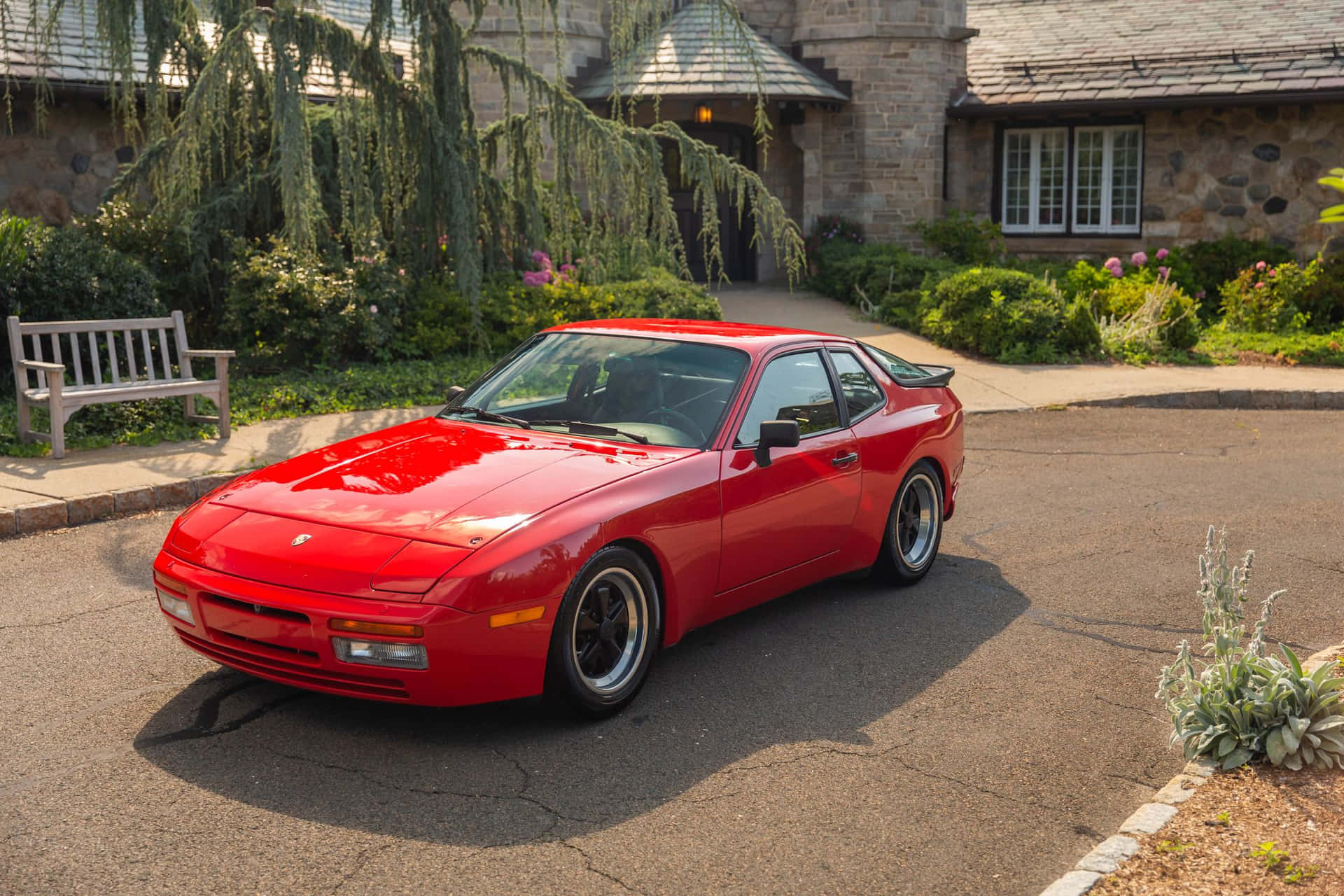 Vintage Porsche 944 Gliding On An Open Road Wallpaper