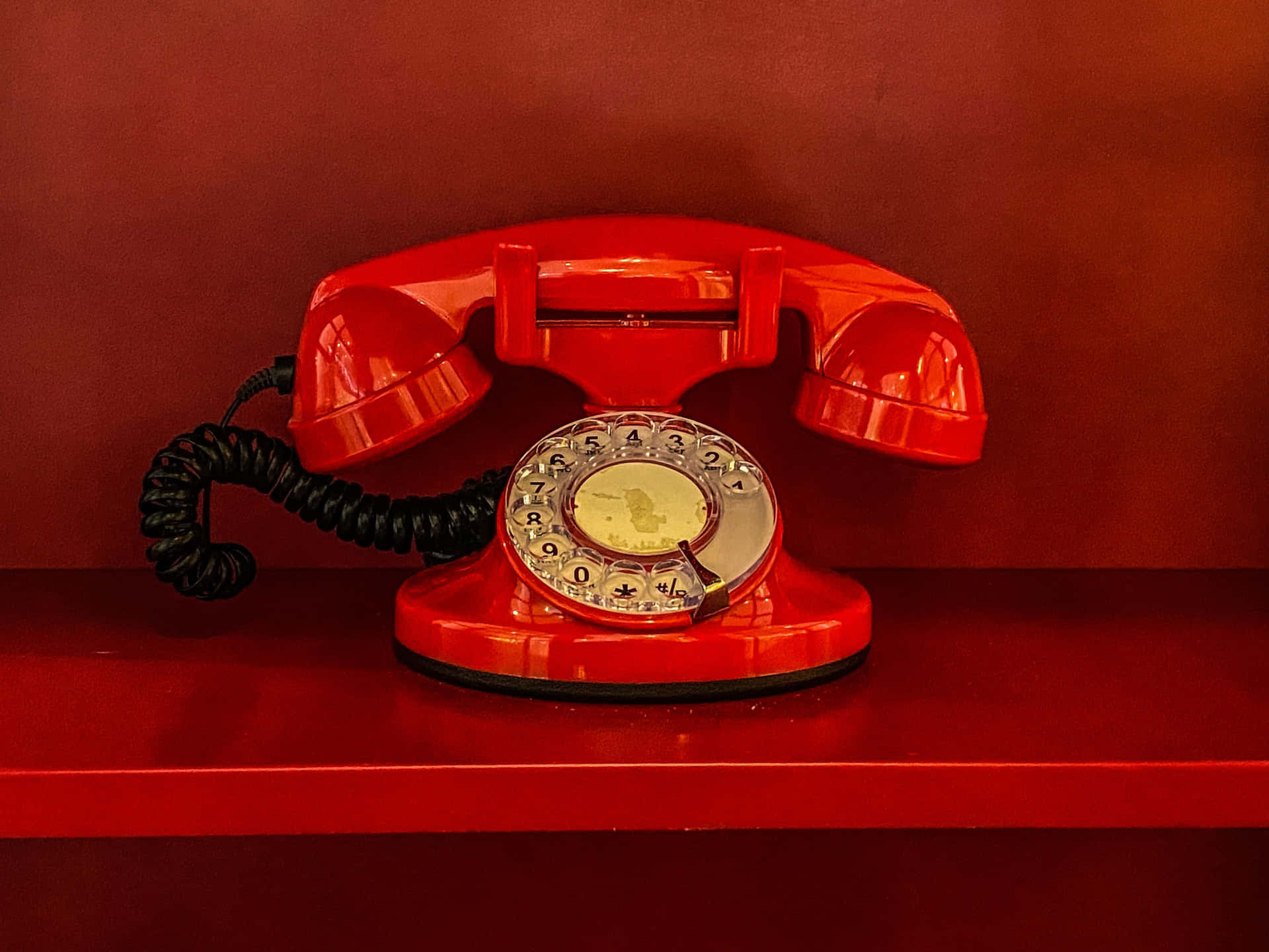 Vintage Red Rotary Phoneon Red Background.jpg Wallpaper