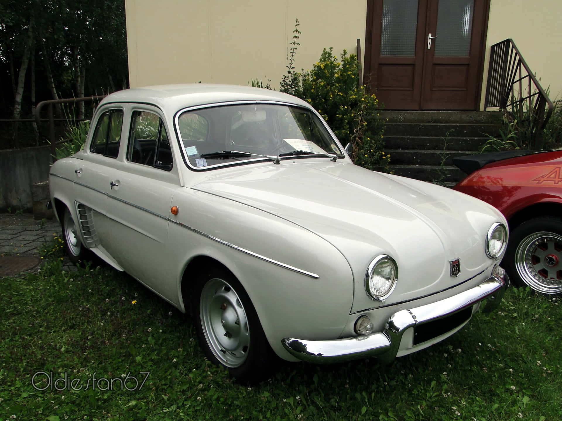 Vintage Renault Dauphine Parked On The Street Wallpaper