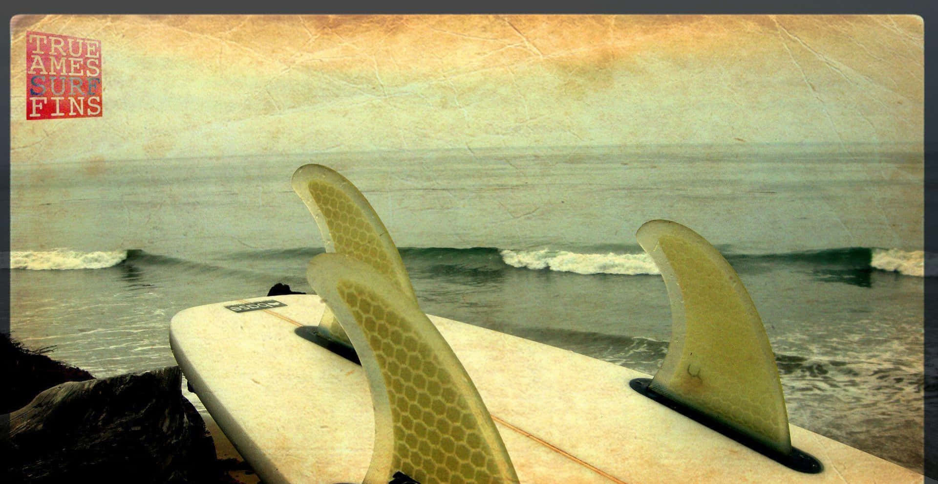 A Surfboard On The Beach Wallpaper