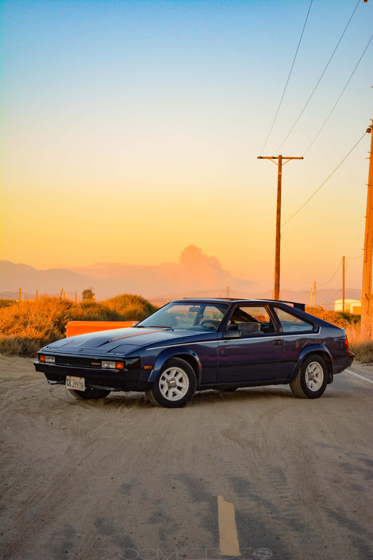 Vintage Toyota Celica Bij Zonsondergang Achtergrond