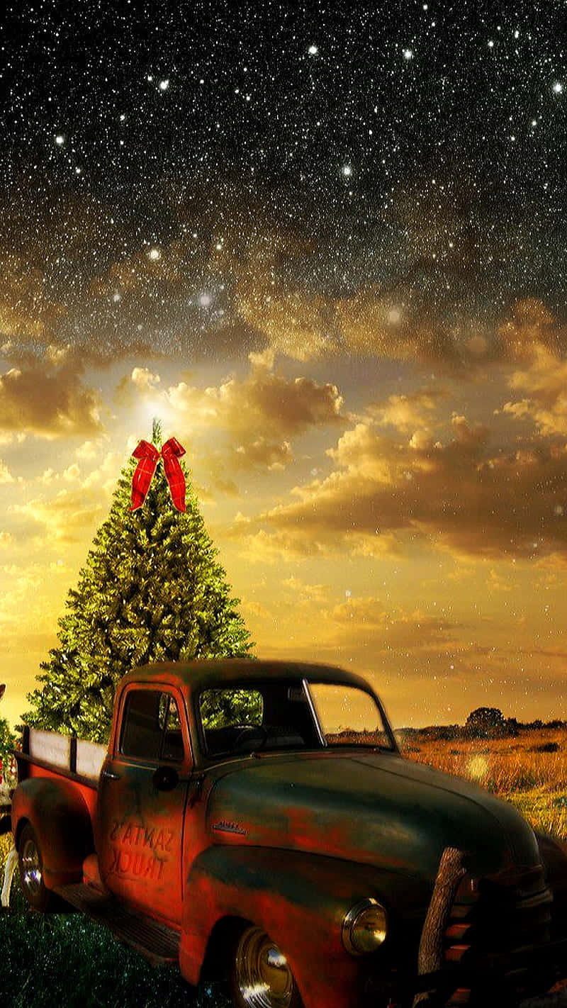 Celebrate the Holidays with a Christmas-themed Vintage Pickup Truck Wallpaper