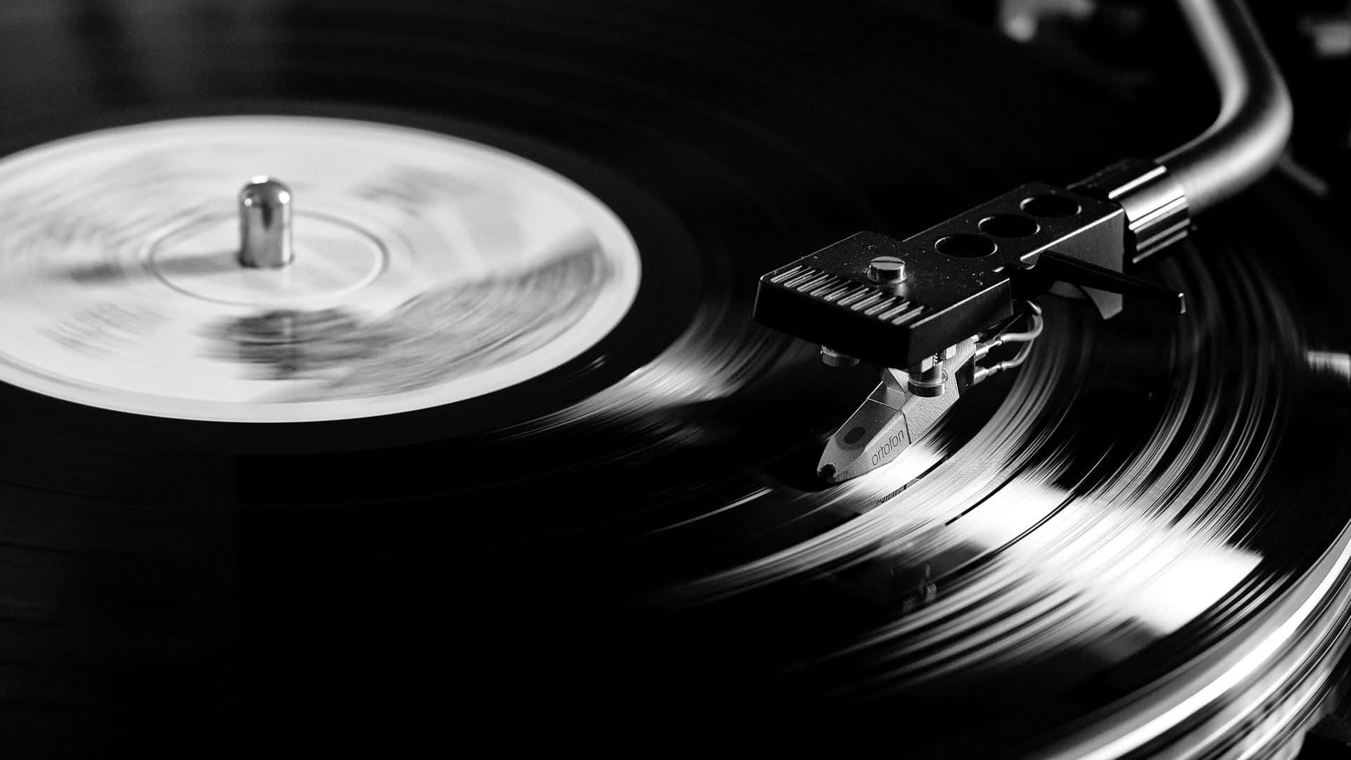 "time-honored Tradition: A Vinyl Record Spins On A Turntable." Wallpaper