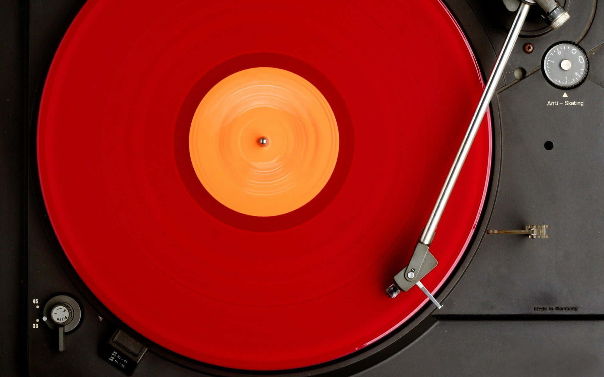 Red Vinyl Record Playing Wallpaper