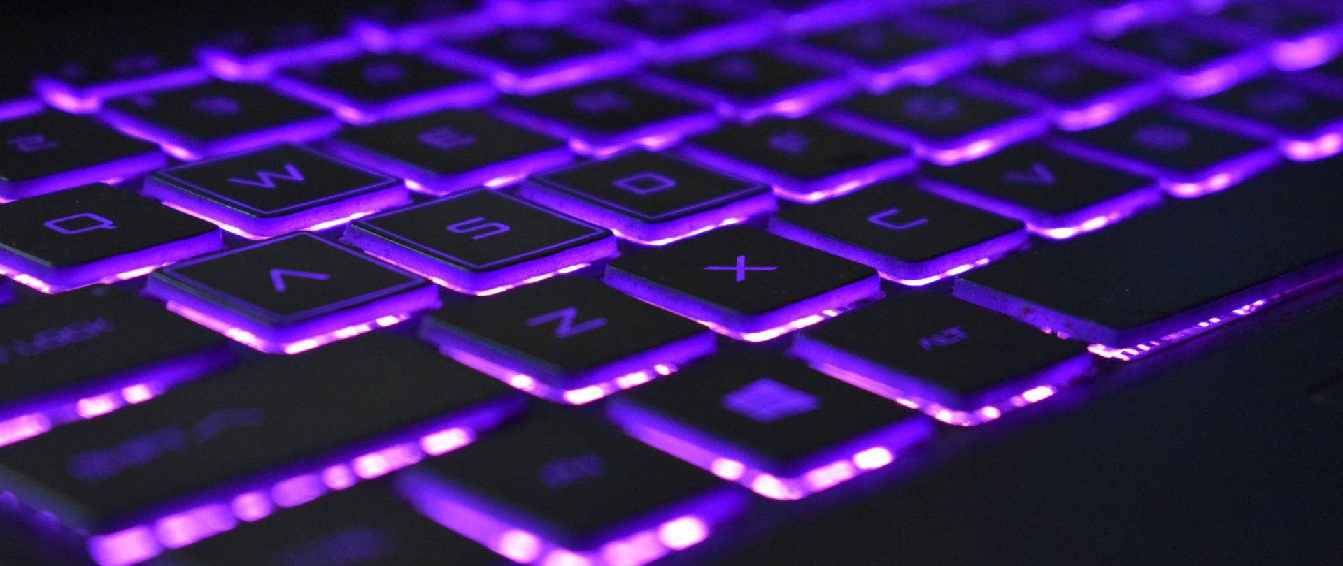 Violet Neon Light Computer Keyboard Background