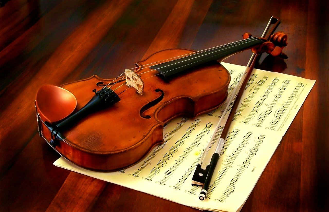 Wooden Chordophone Violin Instrument And Music Sheet Wallpaper