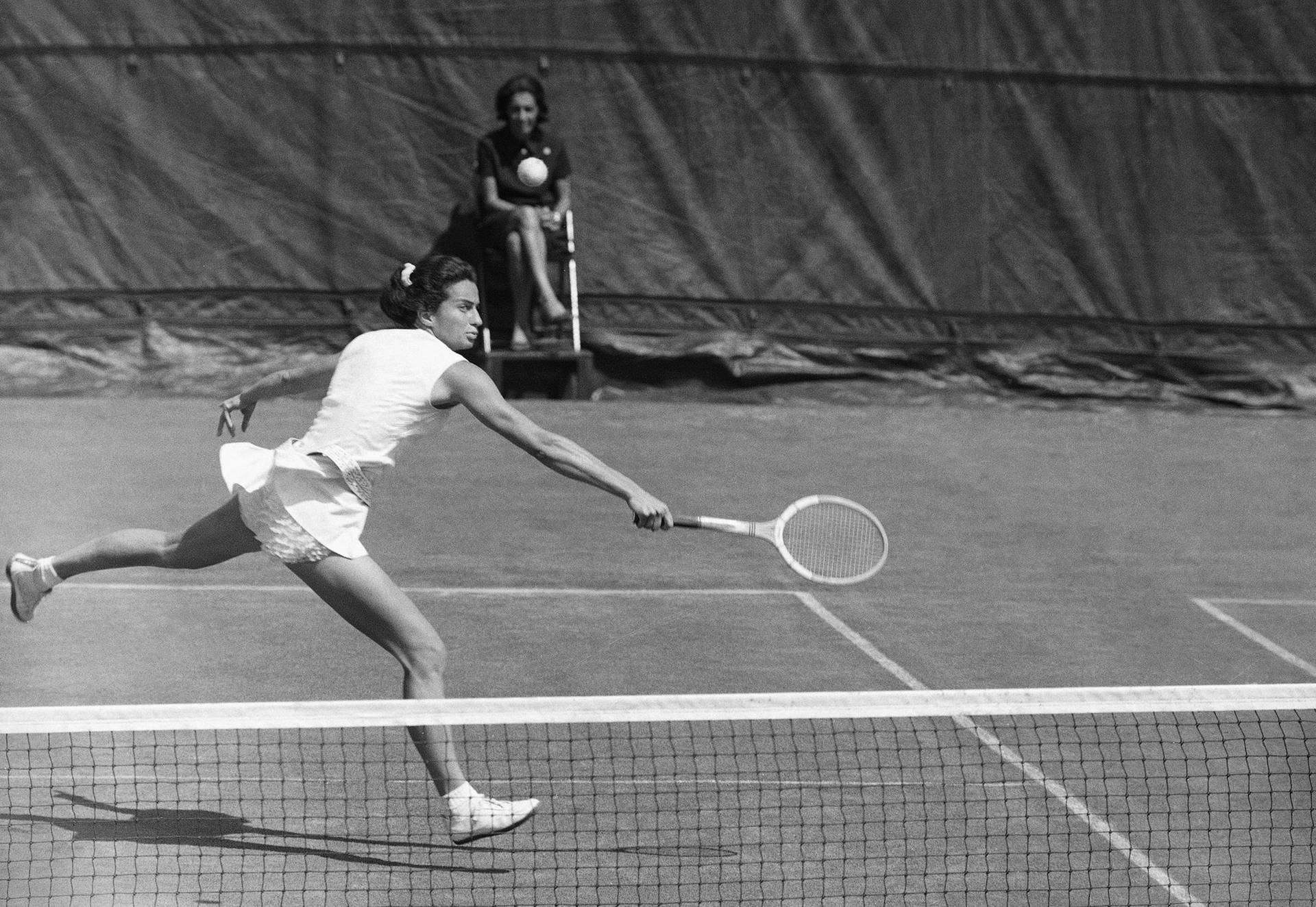 Caption: Virginia Wade in action during a Tennis Match Wallpaper