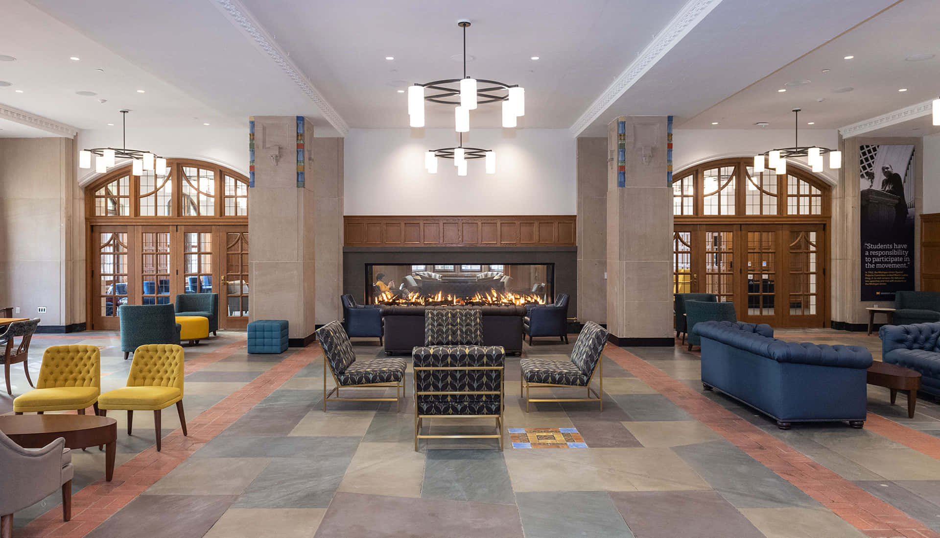 A Lobby With A Fireplace And Chairs