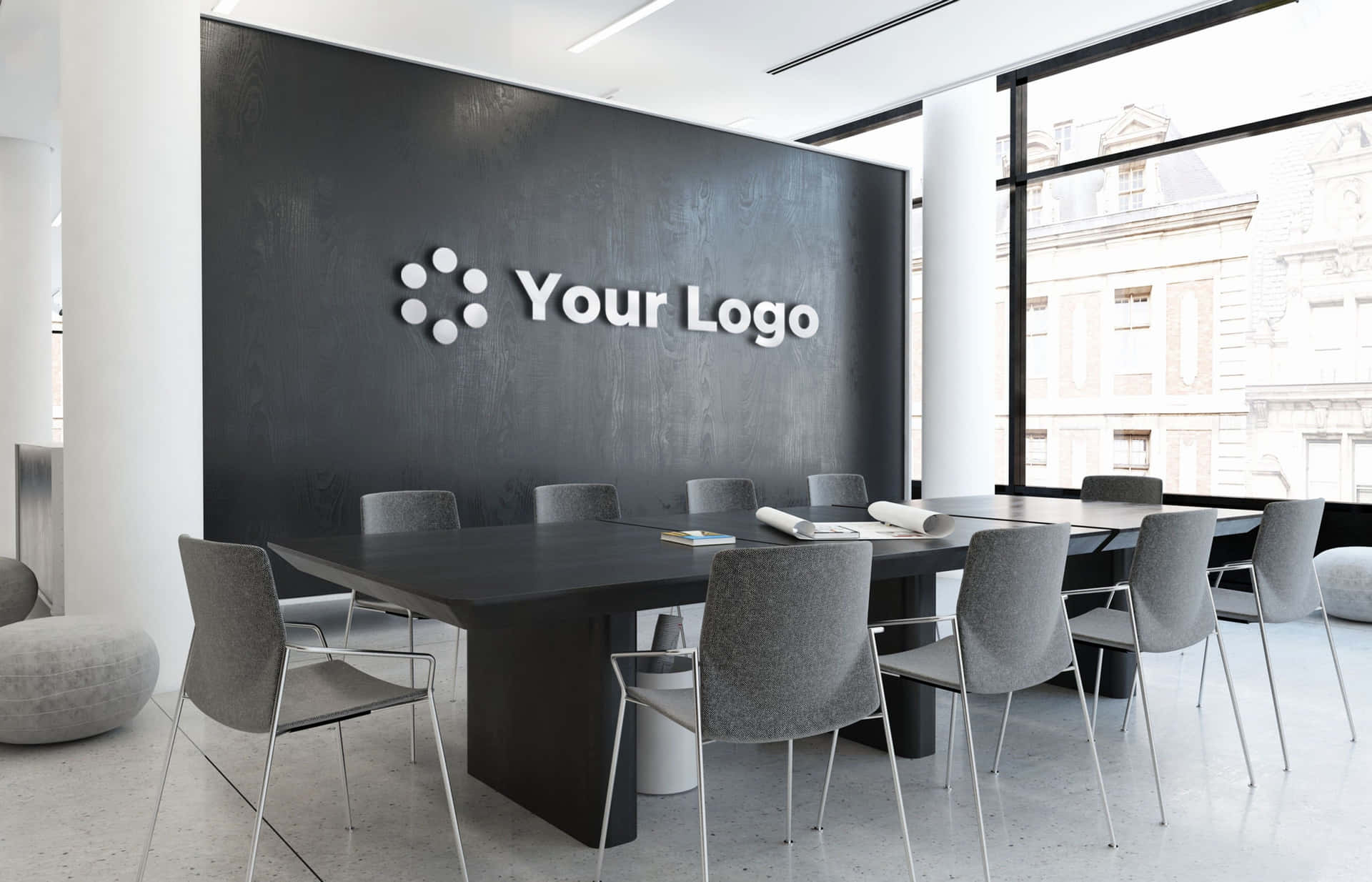 A Conference Room With A Black Table And Chairs