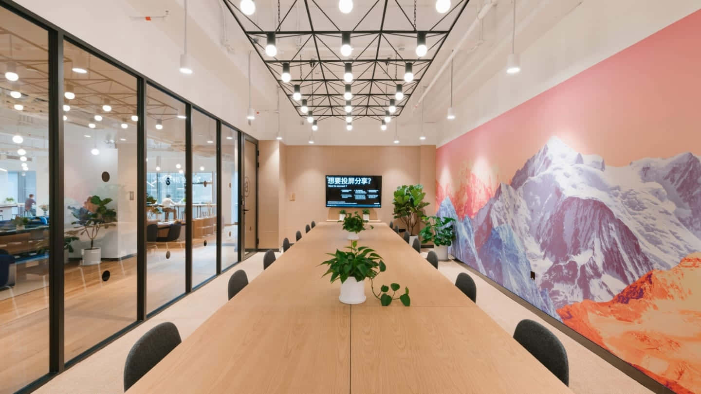 A Conference Room With A Large Table And A Mural