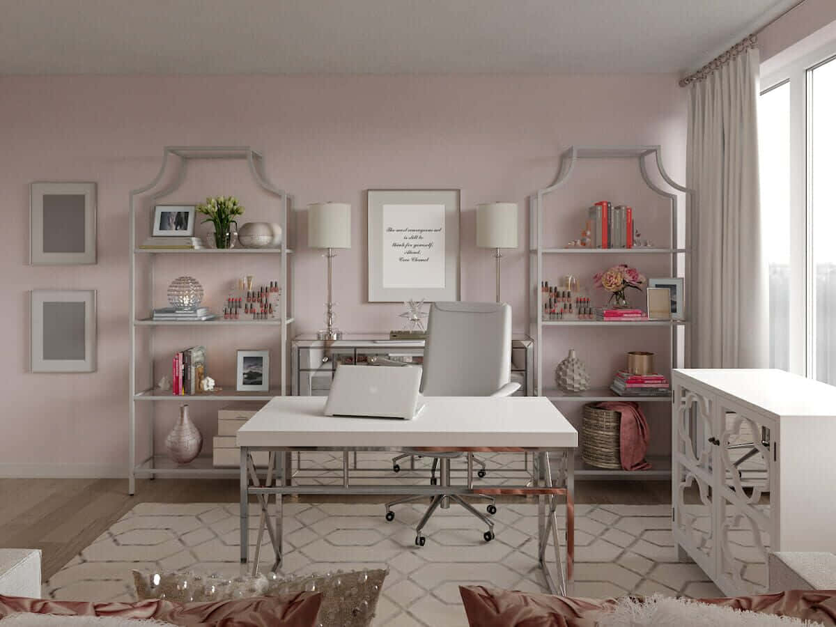 A Pink And White Office With A Desk And Bookshelf